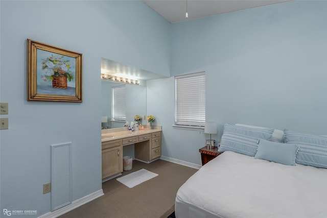 bedroom featuring a towering ceiling