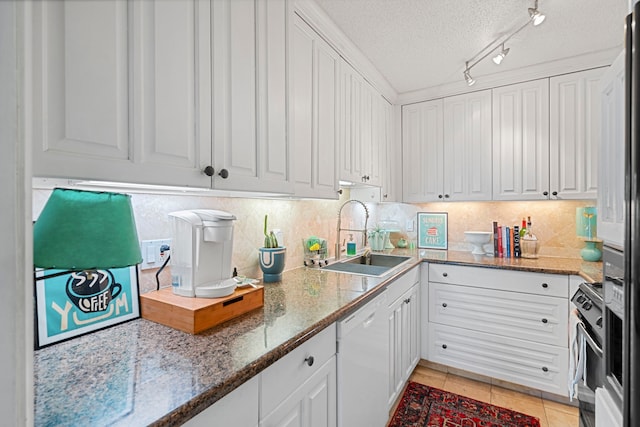 kitchen featuring white cabinets, a textured ceiling, white dishwasher, and sink