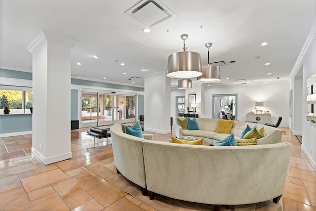 living room featuring ornate columns and ornamental molding