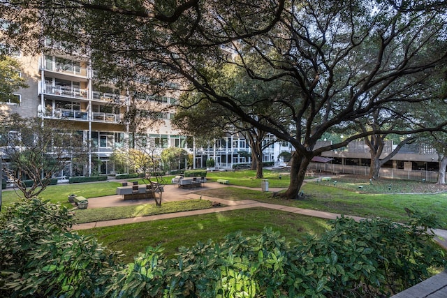 view of home's community with a yard