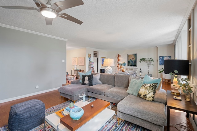 living room featuring crown molding, ceiling fan, a textured ceiling, and hardwood / wood-style flooring