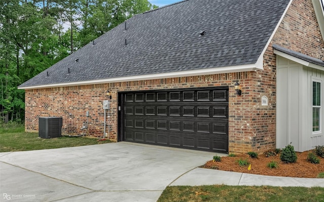 view of property exterior with a garage and central air condition unit