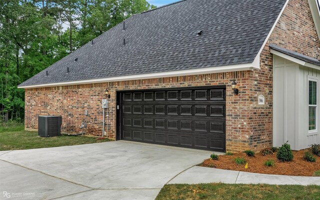 306 W Josie Ln, Haughton, LA 71037 - view of property exterior with a garage and central air condition unit