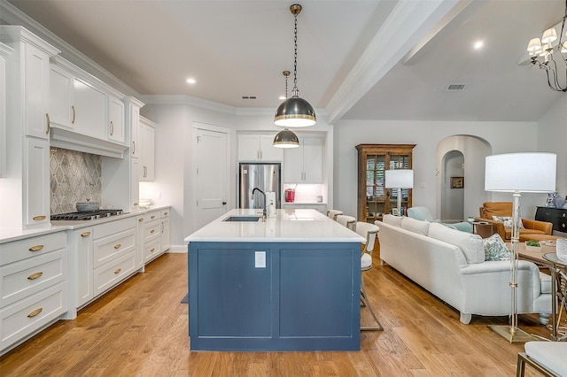 2717 River Path Ct, Burleson, TX 76028 - kitchen with freestanding refrigerator, a sink, open floor plan, white cabinets, and light countertops