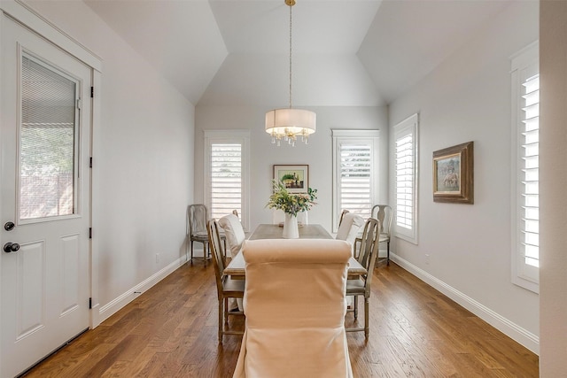 2717 River Path Ct, Burleson, TX 76028 - dining room with a chandelier, healthy amount of natural light, wood finished floors, vaulted ceiling, and baseboards