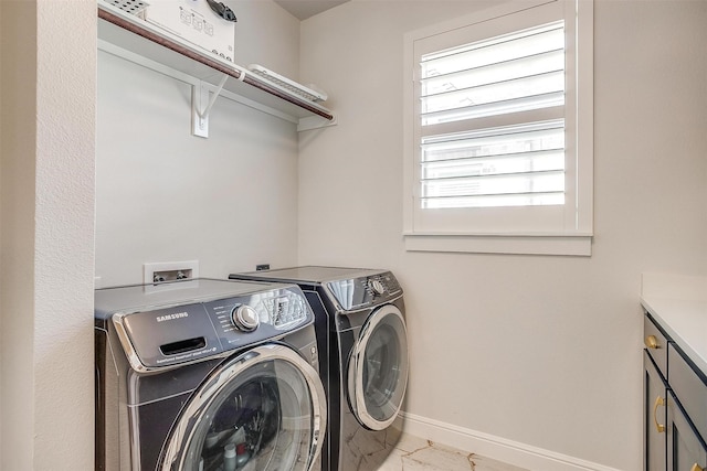 2717 River Path Ct, Burleson, TX 76028 - laundry room with washer and dryer, baseboards, cabinet space, and marble finish flooring