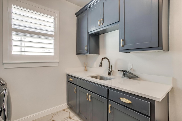 2717 River Path Ct, Burleson, TX 76028 - washroom with cabinet space, baseboards, light marble finish flooring, and independent washer and dryer
