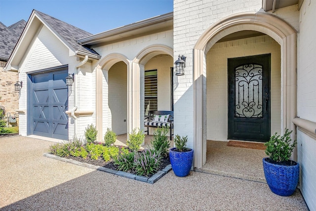 2717 River Path Ct, Burleson, TX 76028 - doorway to property with brick siding, an attached garage, a shingled roof, and driveway