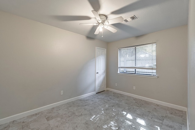 empty room featuring ceiling fan