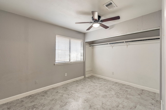 unfurnished bedroom featuring a closet and ceiling fan