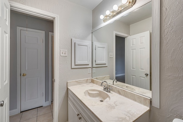 bathroom featuring tile patterned floors and vanity