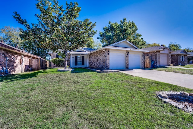 ranch-style home with a garage and a front lawn