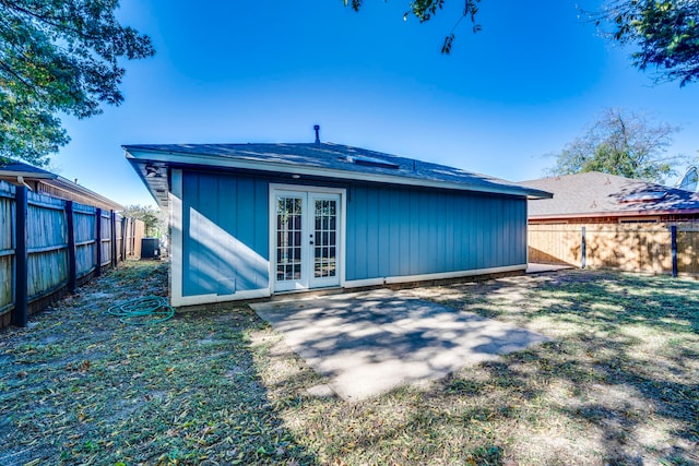 back of house with a lawn, french doors, and a patio