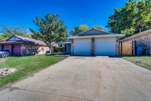 ranch-style house featuring a garage and a front yard