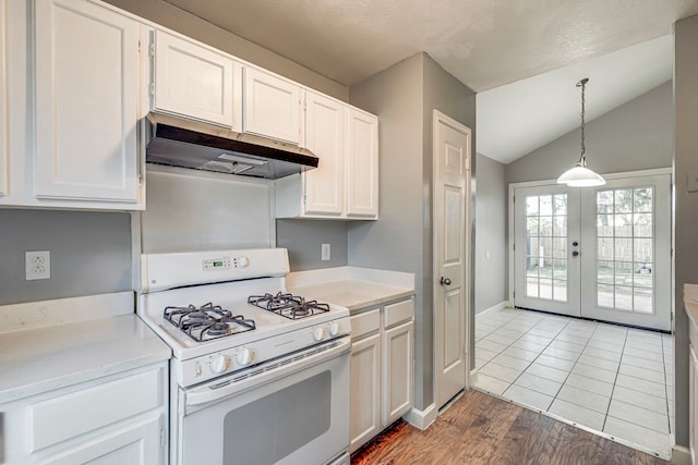 kitchen with french doors, white gas range, vaulted ceiling, wood-type flooring, and white cabinetry