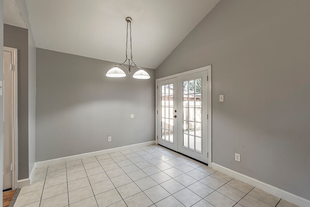 unfurnished dining area with french doors, high vaulted ceiling, light tile patterned floors, and a notable chandelier