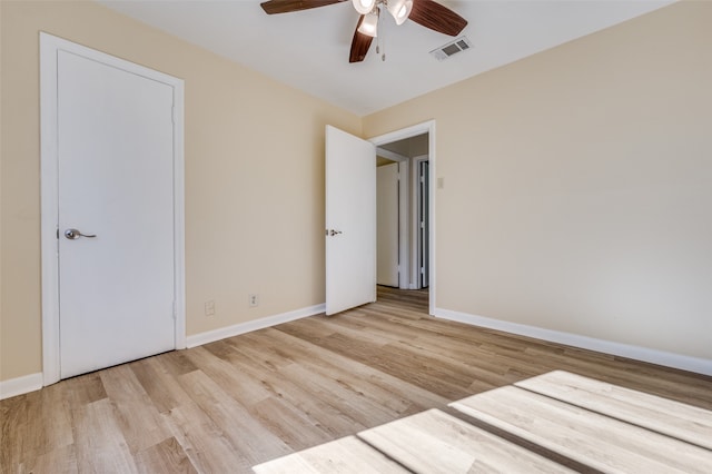 unfurnished bedroom with ceiling fan and light hardwood / wood-style floors