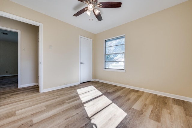 unfurnished bedroom with ceiling fan and light hardwood / wood-style floors