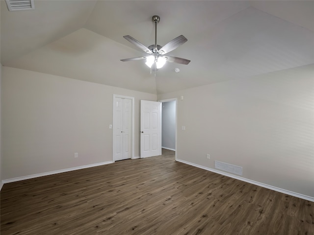 unfurnished room featuring ceiling fan, dark hardwood / wood-style flooring, and vaulted ceiling