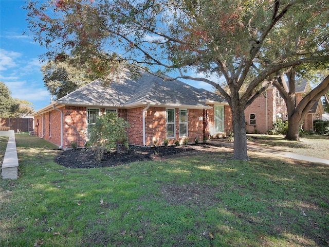 single story home featuring a front yard