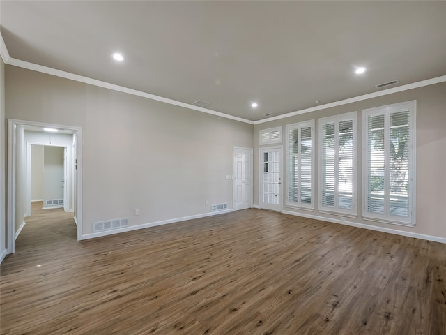 empty room with light wood-type flooring and ornamental molding