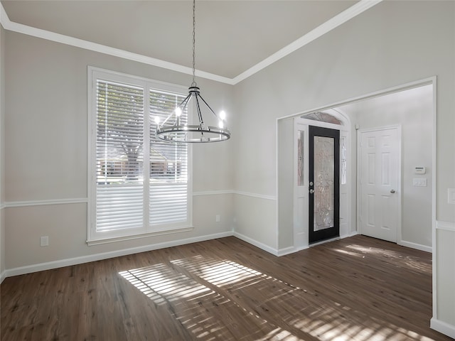 unfurnished dining area featuring a notable chandelier, dark hardwood / wood-style floors, and crown molding