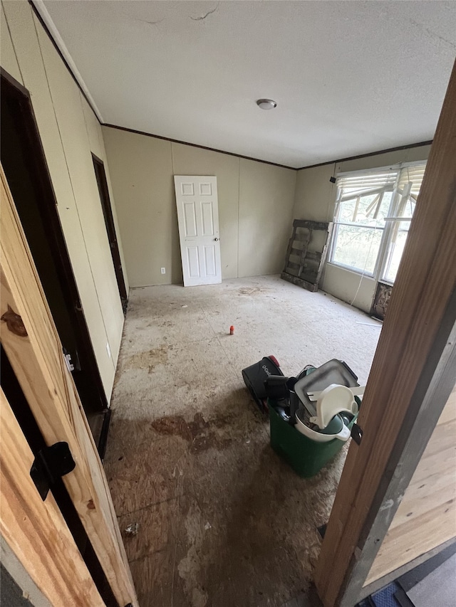 unfurnished bedroom featuring a textured ceiling