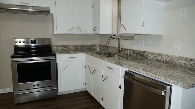 kitchen featuring sink, stainless steel appliances, light stone counters, dark hardwood / wood-style flooring, and white cabinets