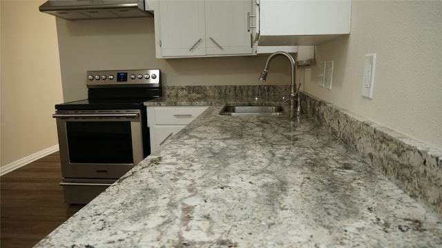 kitchen with white cabinetry, sink, dark hardwood / wood-style floors, ventilation hood, and stainless steel electric range