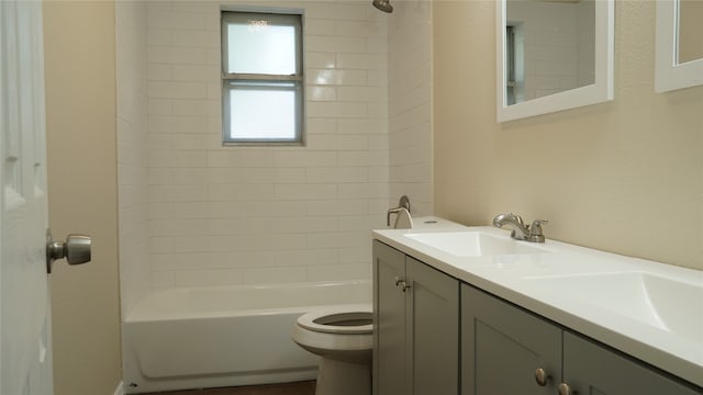 full bathroom featuring vanity, toilet, and tiled shower / bath combo