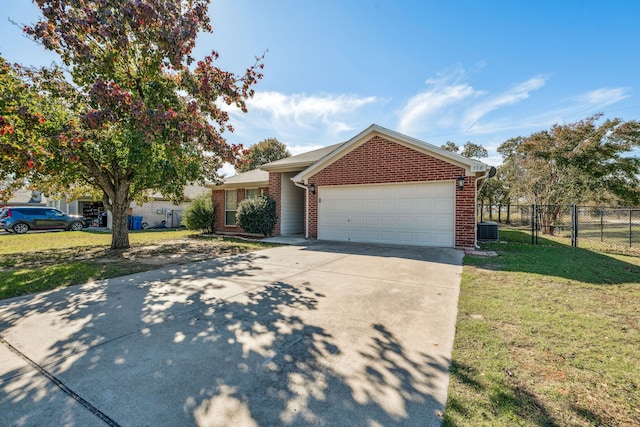 view of front of house featuring a front yard and a garage