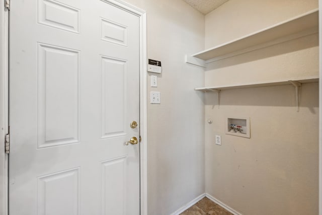 laundry room featuring hookup for a gas dryer, washer hookup, and a textured ceiling