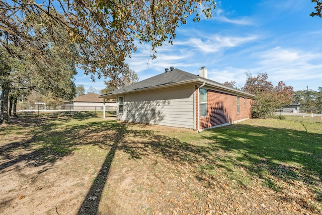 view of home's exterior featuring a lawn