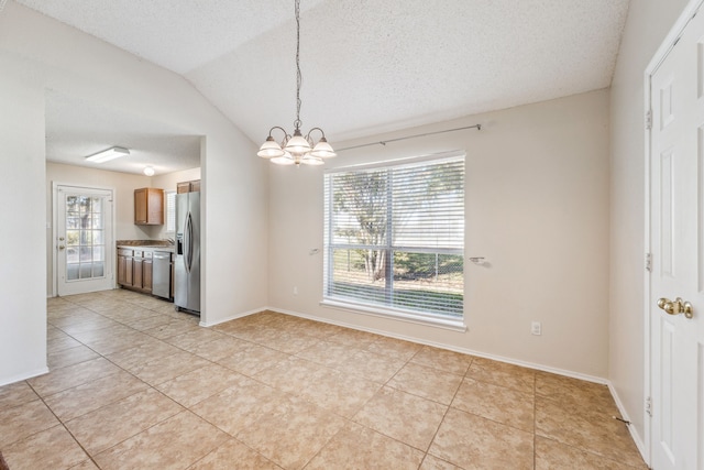 unfurnished dining area with a notable chandelier, plenty of natural light, lofted ceiling, and light tile patterned floors