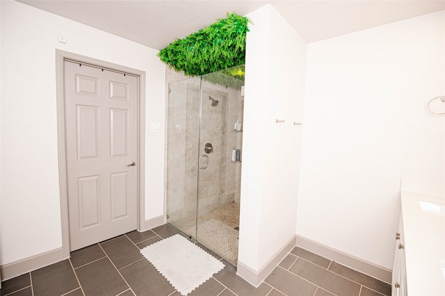 bathroom featuring tile patterned floors and walk in shower