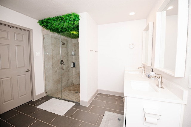 bathroom with vanity, tile patterned floors, and an enclosed shower