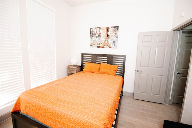 bedroom with light hardwood / wood-style floors