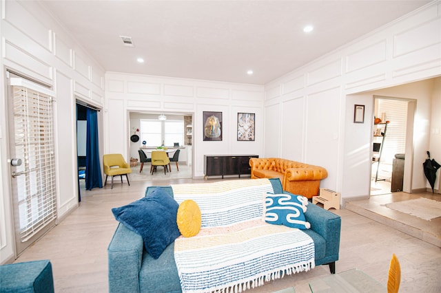 living room with light hardwood / wood-style floors