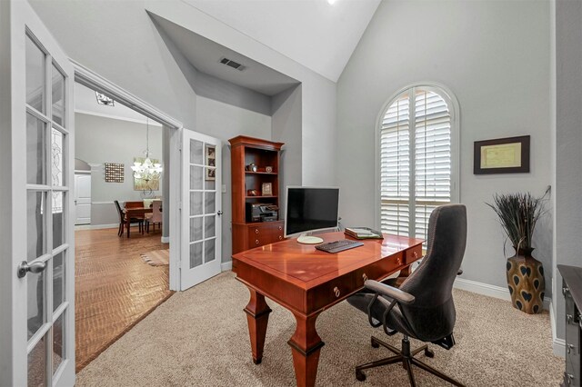 office with french doors, a chandelier, visible vents, high vaulted ceiling, and baseboards