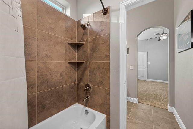 full bathroom featuring bathtub / shower combination, baseboards, a ceiling fan, and tile patterned floors