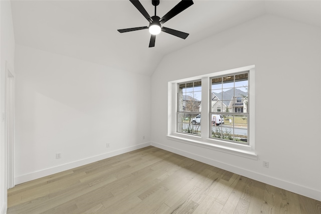 dining room with light hardwood / wood-style flooring, a healthy amount of sunlight, and lofted ceiling