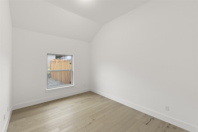 bedroom with hardwood / wood-style flooring, an inviting chandelier, and multiple windows