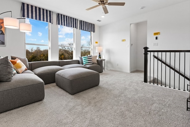 living room featuring light carpet and ceiling fan