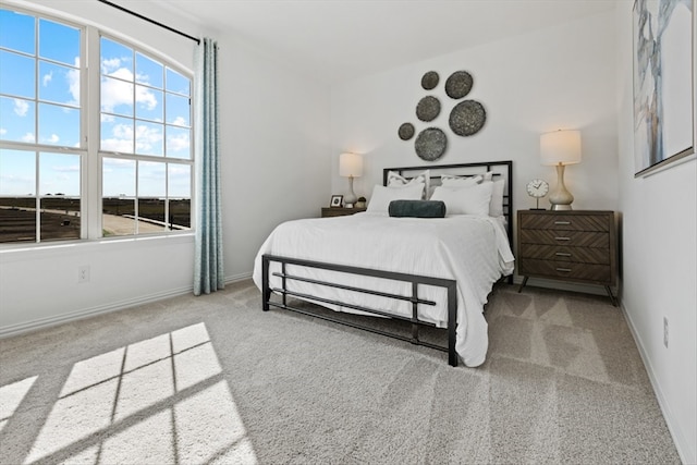 bedroom with light colored carpet