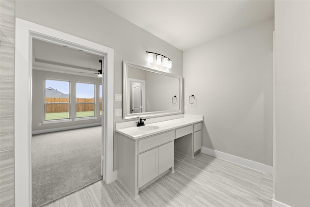 724 Stearman Ln, Fate, TX 75087 - bathroom featuring vanity, ceiling fan, and wood finished floors