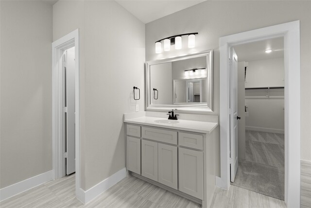 724 Stearman Ln, Fate, TX 75087 - bathroom with vanity and a spacious closet