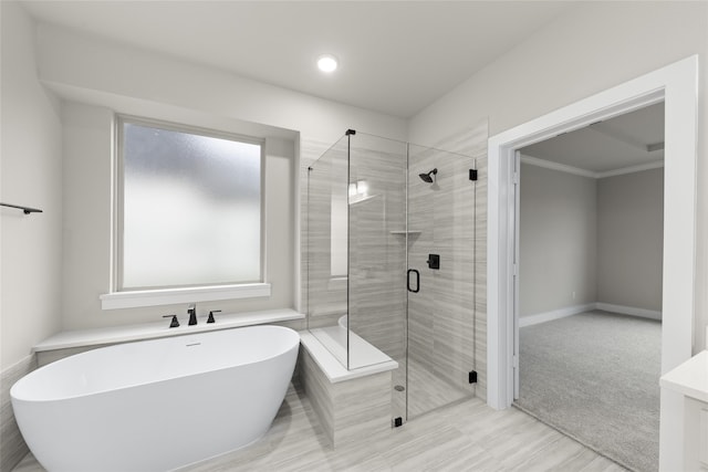 724 Stearman Ln, Fate, TX 75087 - bathroom with a freestanding tub, a shower stall, and recessed lighting