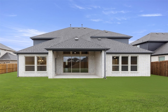 724 Stearman Ln, Fate, TX 75087 - rear view of house with a shingled roof, a fenced backyard, a patio area, and brick siding