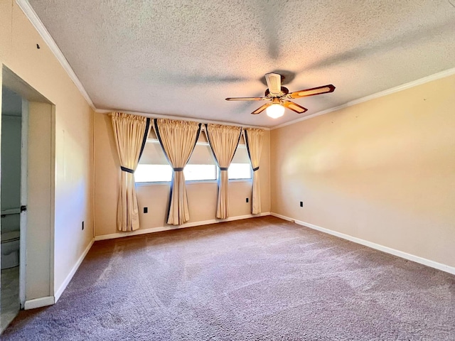 carpeted spare room featuring a textured ceiling, ceiling fan, and crown molding