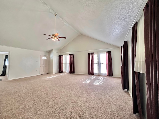 unfurnished living room with a textured ceiling, light colored carpet, high vaulted ceiling, and ceiling fan